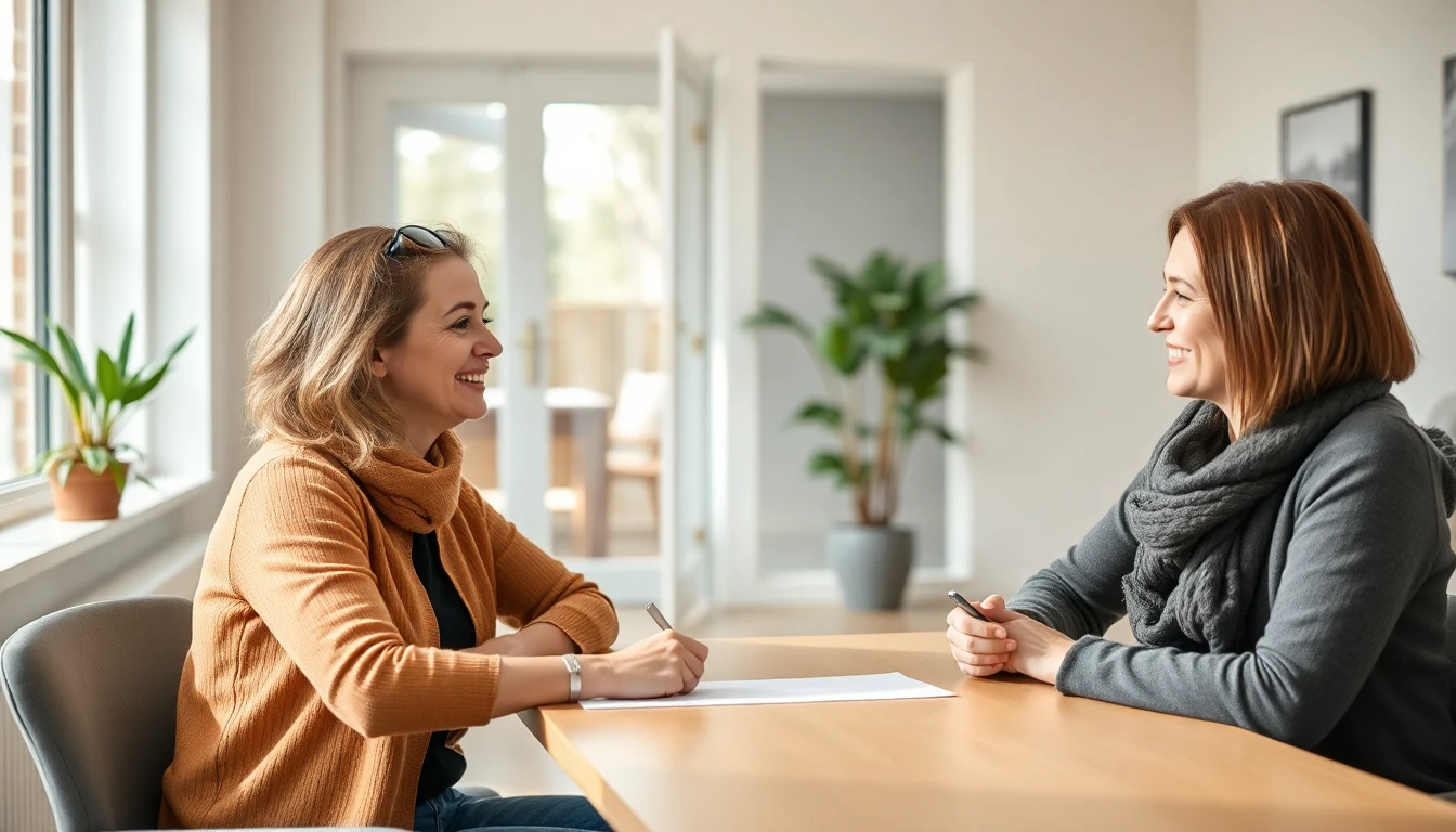 A woman meeting with a counselor at a table in a bright room