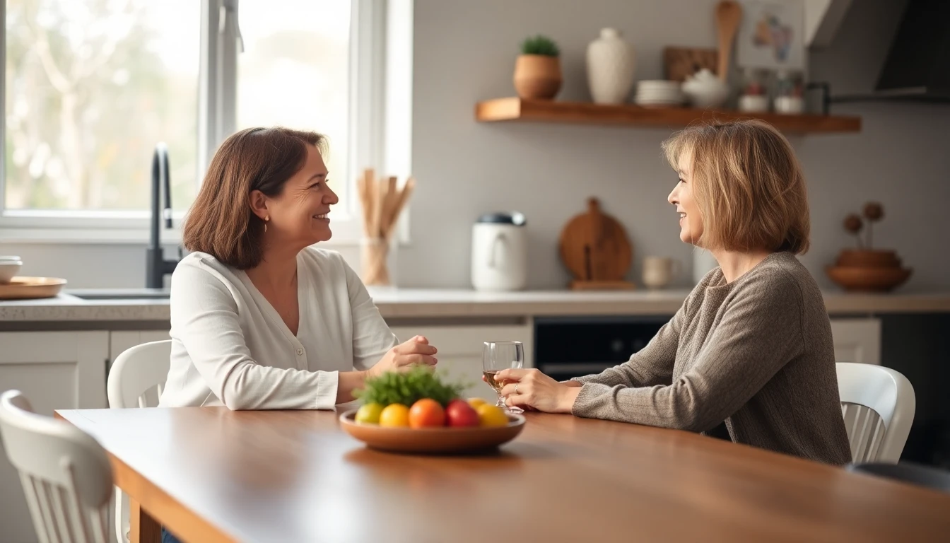 Two women talking warmly across a kitchen table